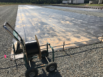 Rolling out space-it in a mum field on weed fabric. Rolling out space-it in a mum field on weed fabric.