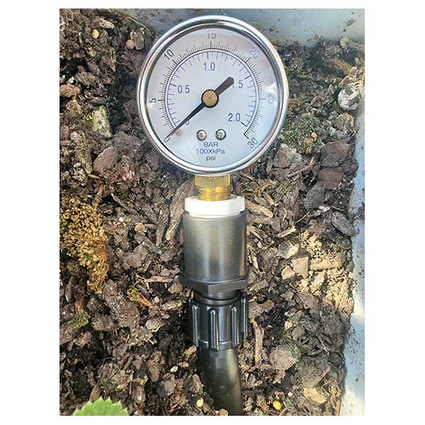 This is a 0-30 pressure gauge on a drip tape connector to measure pressure at the end of your row.